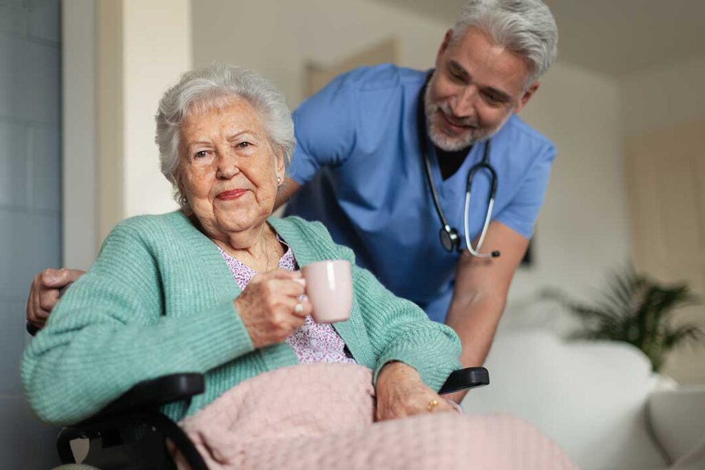 Older adult and family member reviewing an assisted living contract beside a monthly fee statement.